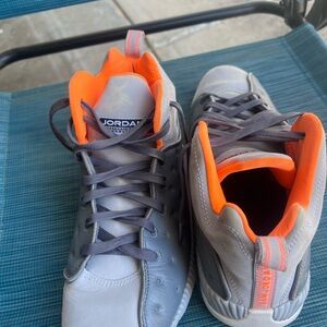 Jordan Gray Sneakers with Vibrant Orange Accents